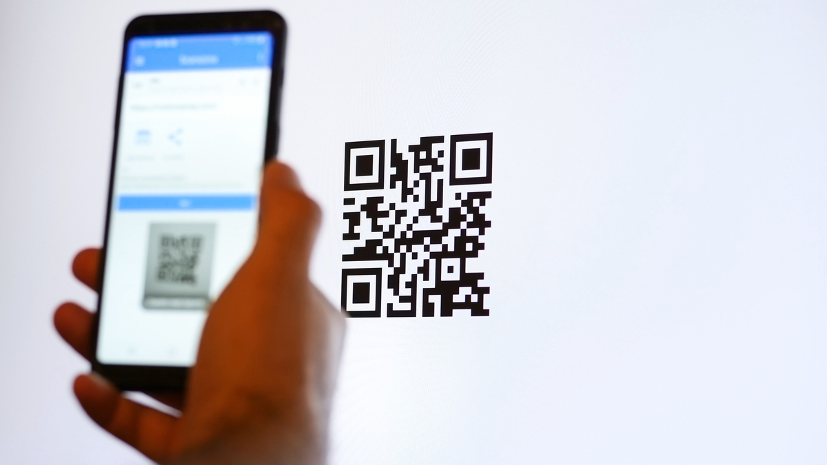 Scan QR code with smartphone on computer monitor.